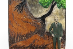Bearded Man by hillside with trees