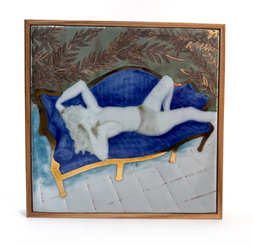 A ghostly woman sprawled on a curvy couch surrounded by foliage on a tile floor.